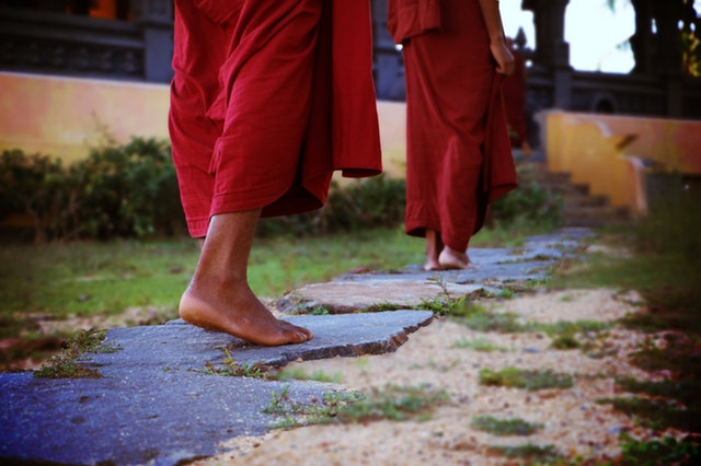 two-human-wearing-monk-dress-walking-on-the-pathway-776291.jpg